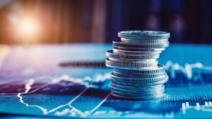 graficos financeiros e moedas empilhadas 1